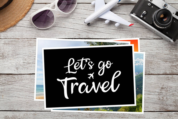 Travel concept with vacation photos, airplane toy, camera and sunglasses on wooden table. Top view flat lay with copy space - Fotoğraf, Görsel