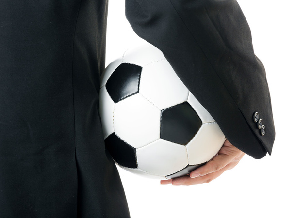 Бизнесмен держит футбольный мяч - Фото, изображение