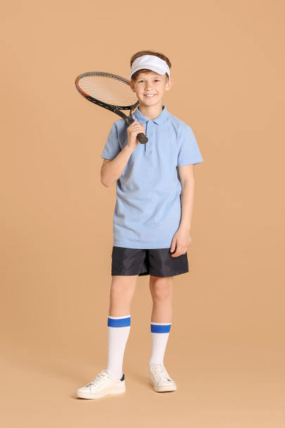Cute little tennis player on color background - Φωτογραφία, εικόνα