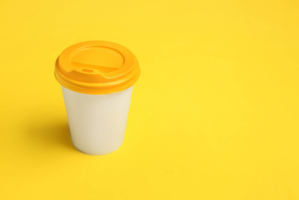 Takeaway cup for drink on color background - Fotografie, Obrázek