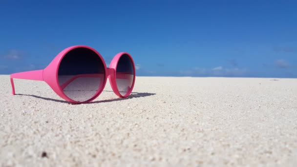 Trendy sunglasses on the beach. Seascape scenic view in Bali.  - Footage, Video