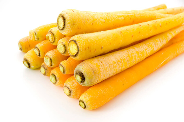 Shimaninjin, type of yellow carrot grown in Okinawa, yellow carrot on white background - Photo, Image