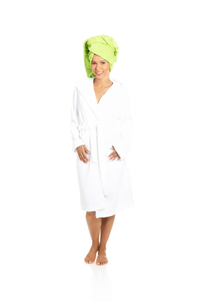 Attractive woman wrapped in towel with turban. isolated on white - Valokuva, kuva