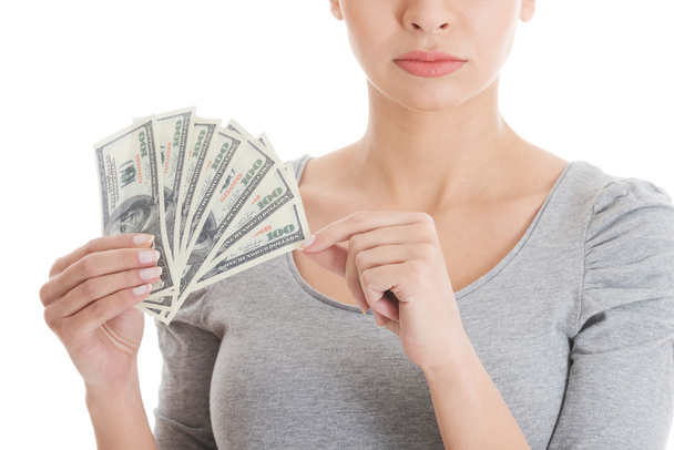 Young beautiful casual woman holding large sum of money. - Photo, Image