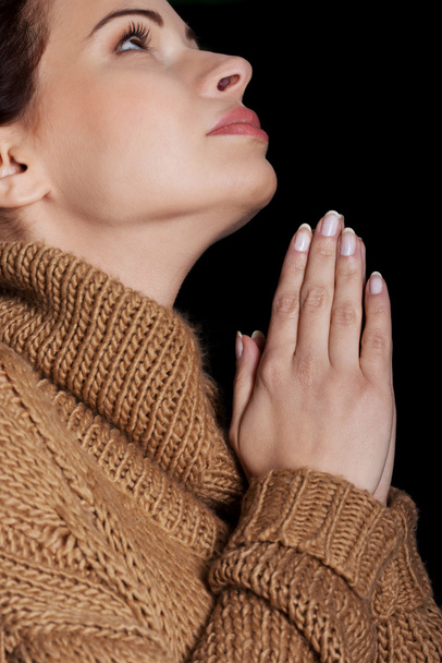 Beautiful young woman is praying. - Photo, image