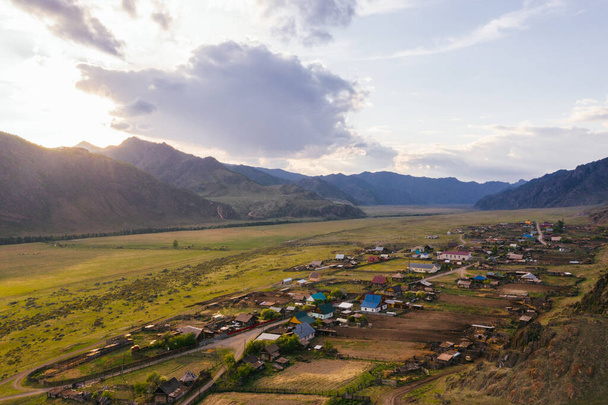Village in Mountain valley aerial drone view - Foto, imagen