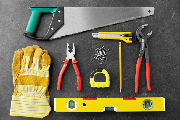 different work tools on slate background - Foto, immagini