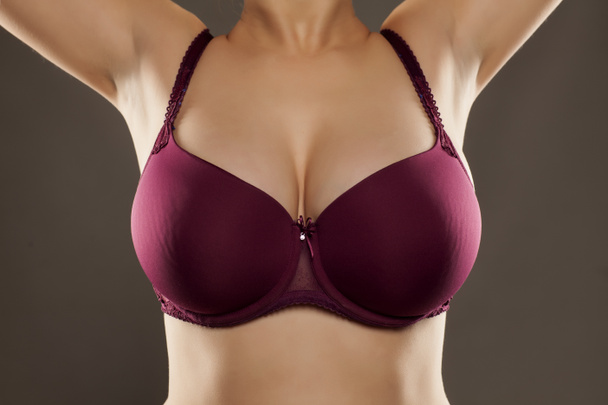 Large and beautiful women breasts in purple bra - Fotó, kép