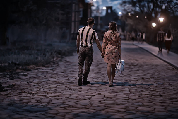 couple in love in the evening city, a man and a woman in a night landscape - Fotografie, Obrázek