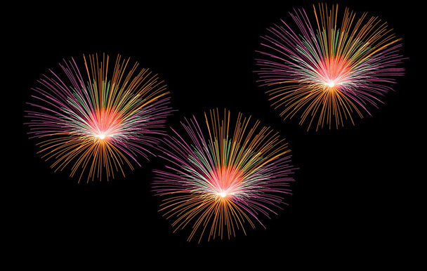 Multicolored fireworks isolated in dark background close up with the place for text, Malta fireworks festival, 4 of July, Independence day, New Year, explode, fireworks, light, concept, saturated - Photo, Image