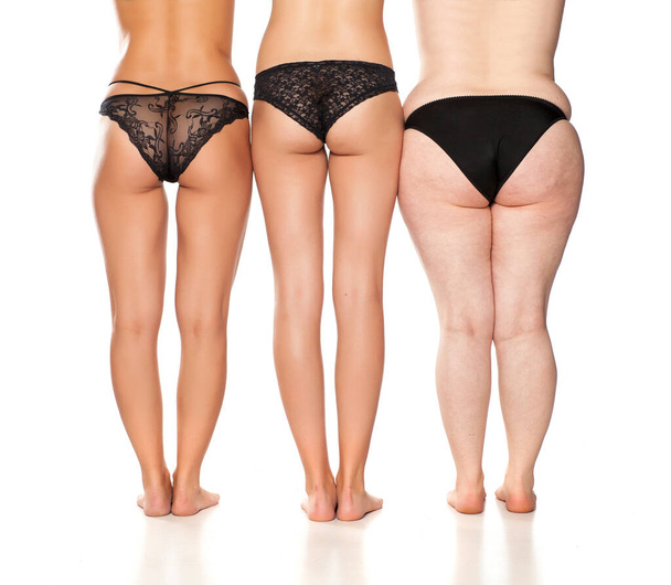 gambe di una donna, tre donne con pesi diversi
. - Foto, immagini