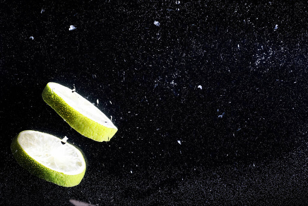 Water drops on ripe sweet lemon. Fresh lime  background with copy space for your text. Vegan and vegetarian concept. - Foto, Bild