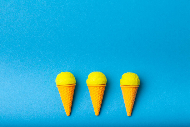 miniature Ice cream on a colorful background. Copy space. Vivid colors - 写真・画像