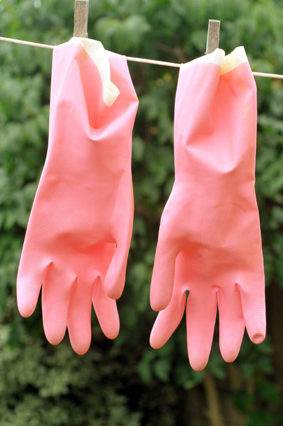 Latex gloves drying on a washing line - Photo, Image