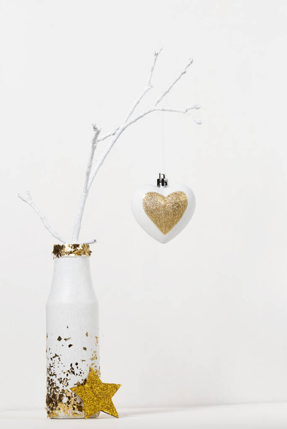 christmas decoration on tree branch in vase on white background - Photo, Image