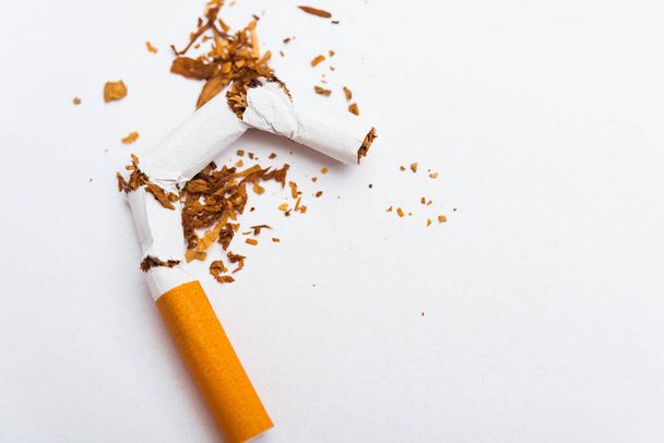 31 May of World No Tobacco Day, no smoking, close up of broken pile cigarette or tobacco STOP symbolic on white background with copy space, and Warning lung health concept - Φωτογραφία, εικόνα