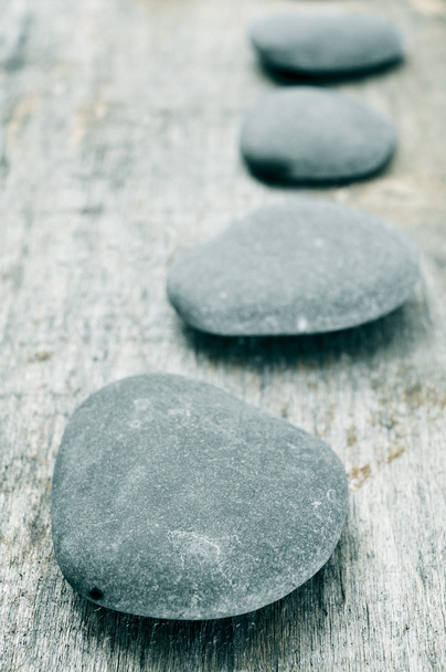 stones on an old wooden surface - Foto, imagen