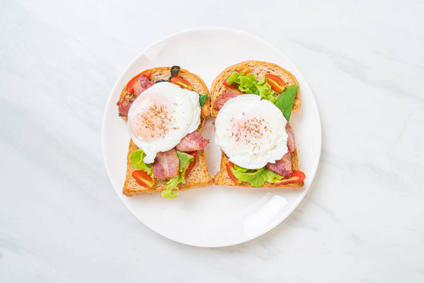 whole wheat bread toasted with vegetable, bacon and egg or egg benedict for breakfast - Foto, imagen