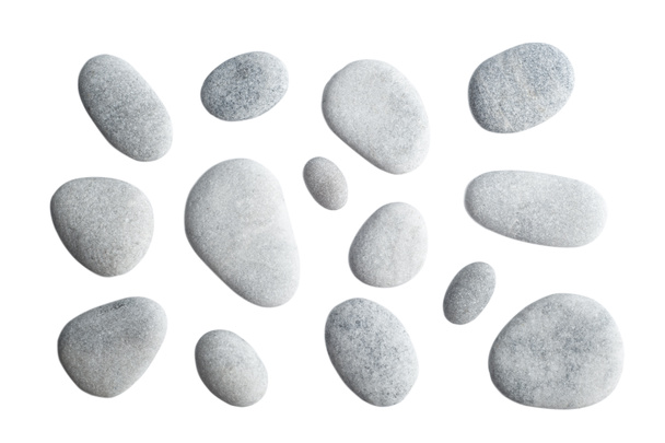 Guijarros grises aislados sobre fondo blanco. Vista superior de piedra marina
 - Foto, imagen