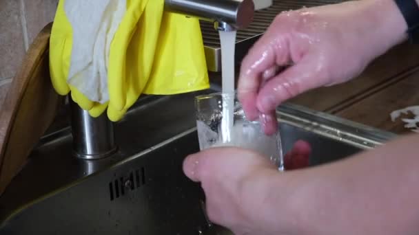 washing cleaning glass worm water on kitchen  - Video
