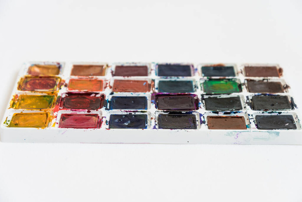 Paint palette, watercolor side view. Background Variety of colors. - 写真・画像