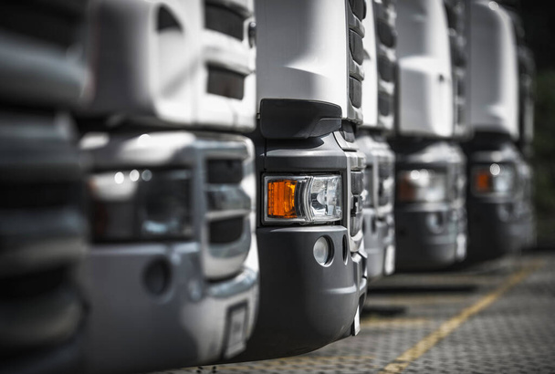 Heavy Duty Transportation industry. Line of New and Pre-Owned Semi Trucks on Dealership Sales Lot. - Фото, изображение