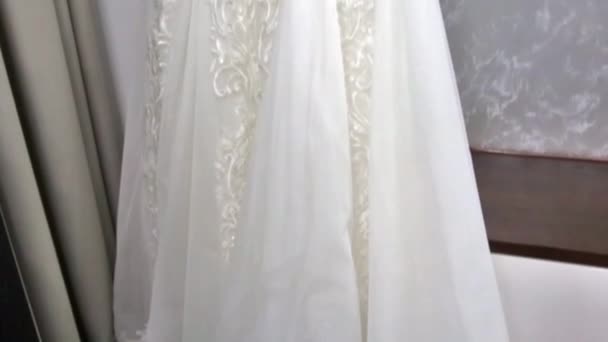 the camera flies over the wedding dress and shows its embroidery - Footage, Video