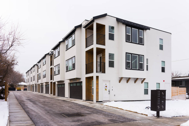 Street view of contemporary apartment or condominium building - Фото, изображение