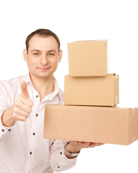 Businessman with parcels - Фото, изображение