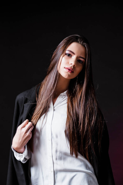 Beauty. Femininity. Beautiful female face with perfect genuine skin. Beauty salon. Make-up artist. Portrait of a beautiful woman in the studio. Girl in a white shirt and jacket. Face. Pretty Girl. - Foto, imagen