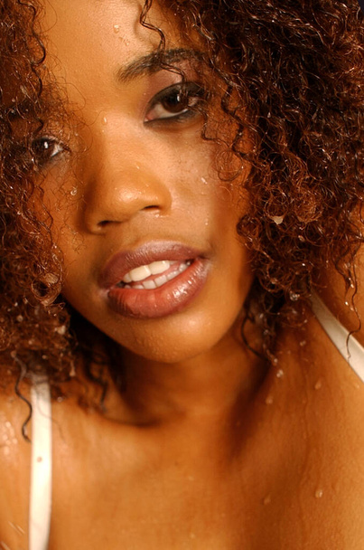 Lovely African American happy girl fun shoot in the shower - Photo, Image