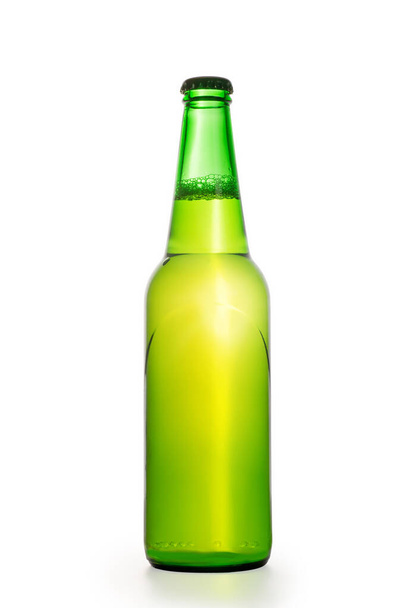 Green glowing beer bottle. Isolated on white, clipping path included - Φωτογραφία, εικόνα