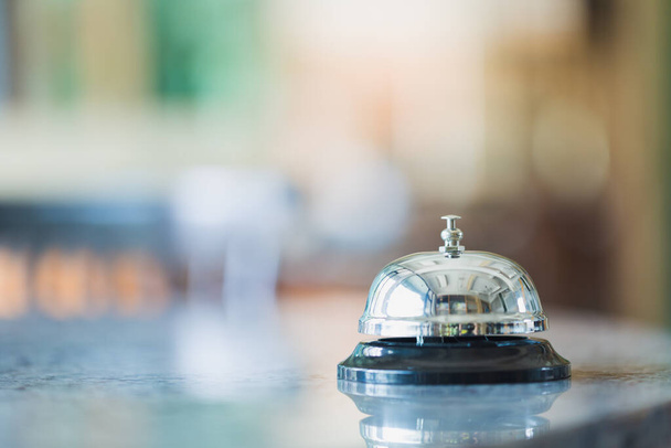 Bell on counter for service with blurred background - Photo, Image