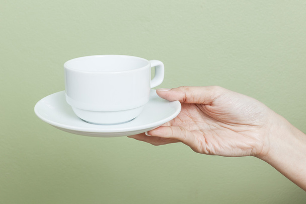 taza de té o café en la mano
 - Foto, Imagen