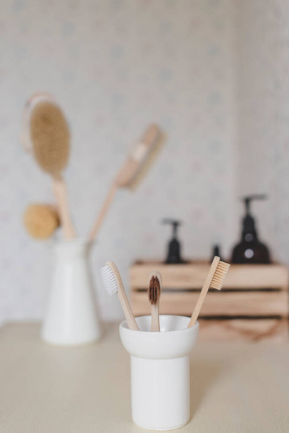 wooden toothbrush in the bathroom - Zdjęcie, obraz