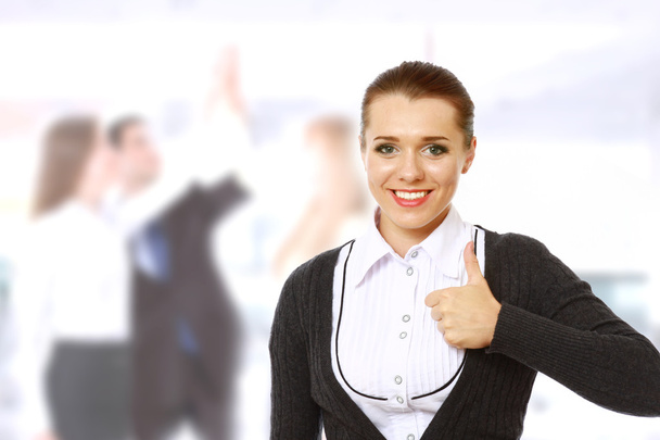 A successful businesswoman showing ok - Фото, изображение