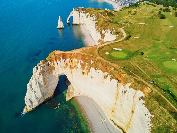 Picturesque panoramic landscape of white chalk cliffs and natural arches of Etretat, Seine-Maritime department of Normandy in France - Foto, Bild