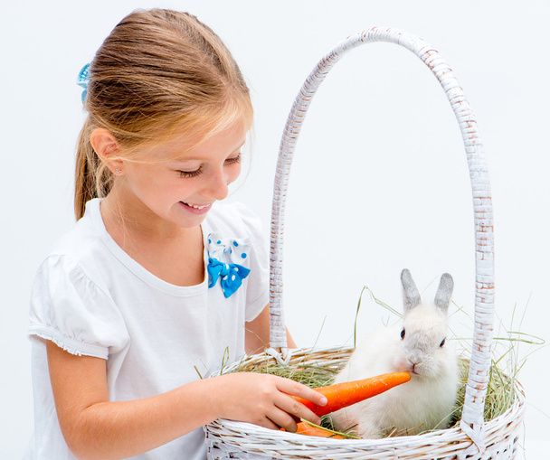 Little girl with a rabbit - Фото, зображення