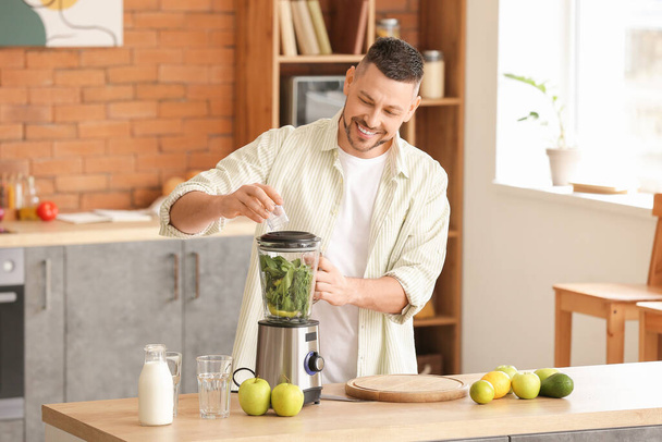 Man making healthy smoothie at home - Photo, Image