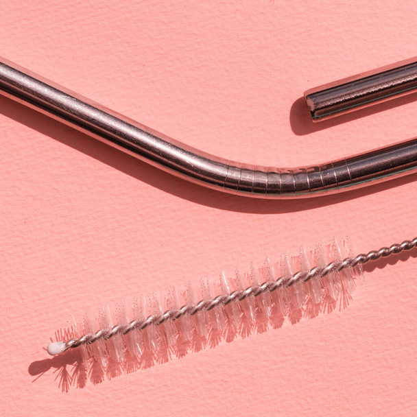 Reusable stainless steel straws and cleaning brush  on pink background, eco friendly lifestyle. Concept zero waste. Macro. pop art style - Φωτογραφία, εικόνα