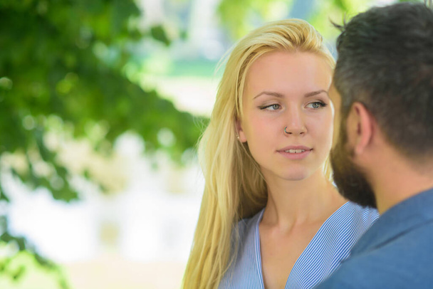 First meet of strangers, girl looks at bearded man - Foto, afbeelding