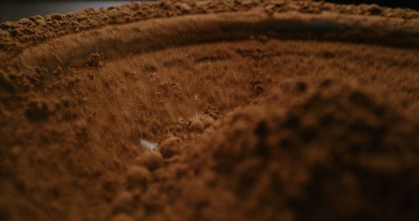 Cocoa powder vibrating on subwoofer - Фото, изображение