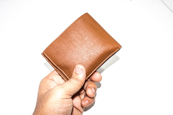Een schilderstuk van portemonnee op witte achtergrond - Foto, afbeelding