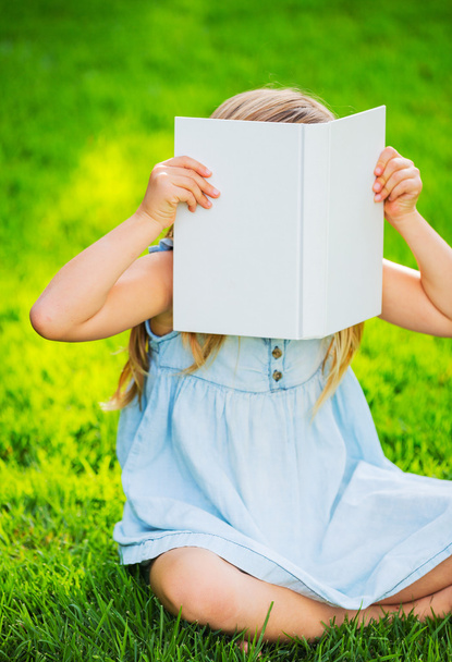 Adorable cute little girl reading book - Фото, изображение