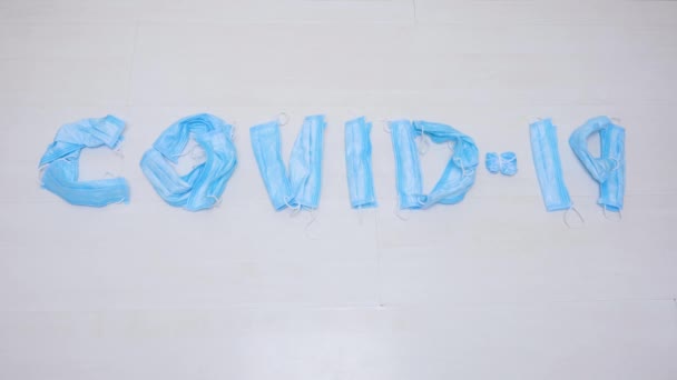 COVID-19 inscription wiped away with mop. Infectious waste, prevented virus covid-19 by separating infected waste. Cleaning in public place hospital during epidemic. Used medical protection - Footage, Video