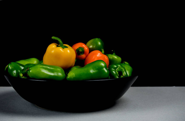 green and orange peppers on timeless still life - Photo, Image