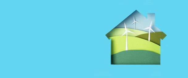 Groene alternatieve milieuvriendelijke energie. Windmolen turbines landschappen in papier gesneden huis. Papercraft ecologische banner - Foto, afbeelding