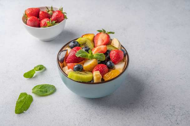 Fresh fruit salad with different ingredients. Healthy diet. Copy space for text - Photo, Image