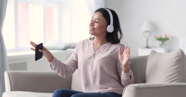 Happy young mixed race woman listening dancing to music. - Imágenes, Vídeo