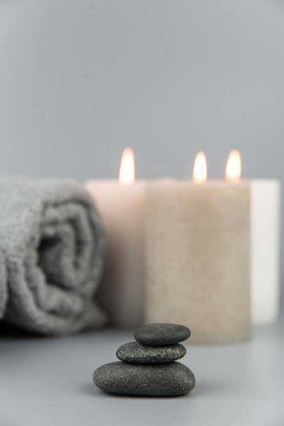 Towel with aromatic candles. Aromatherapy and beauty. Concept set of harmony, massage, balance and meditation, spa, relax, beauty spa treatment. - Photo, Image